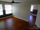 Bedroom with hardwood floors, natural light, and neutral paint scheme at 101 Colony Acres Dr, Charlotte, NC 28217