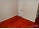 An empty bedroom offering a blank canvas with gleaming hardwood floors and fresh paint at 101 Colony Acres Dr, Charlotte, NC 28217