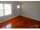 Bright room featuring wood floors, natural light, and freshly painted walls at 101 Colony Acres Dr, Charlotte, NC 28217