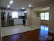 Modern kitchen with stainless steel appliances, white cabinets, and an open layout at 101 Colony Acres Dr, Charlotte, NC 28217