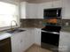 Updated kitchen featuring stainless steel appliances, modern countertops, and white cabinets at 101 Colony Acres Dr, Charlotte, NC 28217