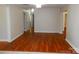 Spacious and bright room featuring wood floors and freshly painted walls at 101 Colony Acres Dr, Charlotte, NC 28217