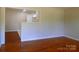 Spacious living room with polished wood floors and a bright, open atmosphere at 101 Colony Acres Dr, Charlotte, NC 28217