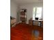 Office with wood floors, a large window, a desk, and ample storage at 101 Colony Acres Dr, Charlotte, NC 28217