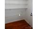 Efficient room with ample shelving, hardwood floors and convenient access to exterior door at 101 Colony Acres Dr, Charlotte, NC 28217