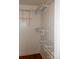 This walk-in closet has wall-to-wall white wire shelving and wooden floors at 101 Colony Acres Dr, Charlotte, NC 28217