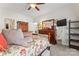 Bright bedroom with a mounted TV, wooden dresser, and soft pillows at 101 Park View Dr, Belmont, NC 28012