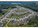 Aerial view of a neighborhood, featuring a community pool surrounded by trees and the property at 108 Hillston Lane at 108 Hillston Ln, Mooresville, NC 28115