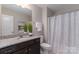 Modern bathroom features a granite vanity, neutral walls, and a shower/tub combo at 108 Hillston Ln, Mooresville, NC 28115
