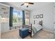 Bright bedroom with large windows, built-in shelves, and cozy decor offers a peaceful retreat at 108 Hillston Ln, Mooresville, NC 28115