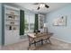 Inviting home office space with custom built-ins, a large window, and a cozy desk at 108 Hillston Ln, Mooresville, NC 28115