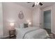 Cozy bedroom with a decorative mirror, stylish lamps, and a plush patterned comforter at 108 Hillston Ln, Mooresville, NC 28115