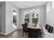Light-filled dining area with bench seating overlooks the backyard at 108 Hillston Ln, Mooresville, NC 28115