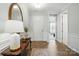 Elegant entryway featuring hardwood floors, decorative table, and mirror creating a warm welcome at 108 Hillston Ln, Mooresville, NC 28115