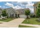 Attractive home boasting a manicured lawn, a two-car garage, and inviting curb appeal at 108 Hillston Ln, Mooresville, NC 28115