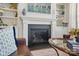 Living room fireplace with built-in shelves, providing a cozy focal point for gathering with Gathering at 108 Hillston Ln, Mooresville, NC 28115