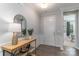 Bright entryway showcasing wood floors, white trim, and a stylish console table with decor at 108 Hillston Ln, Mooresville, NC 28115