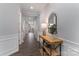 Elegant hallway features wood floors, crisp white trim, and a decorative console table at 108 Hillston Ln, Mooresville, NC 28115