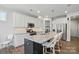 Modern kitchen with stainless steel appliances, granite countertops, and large island is great for cooking at 108 Hillston Ln, Mooresville, NC 28115