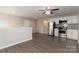 A spacious living area with kitchen has luxury vinyl plank flooring at 108 Hillston Ln, Mooresville, NC 28115