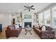 Bright living room with a fireplace, perfect for relaxing and entertaining at 108 Hillston Ln, Mooresville, NC 28115