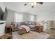 Cozy upstairs living area with hardwood floors, large sectional sofa, and natural light at 108 Hillston Ln, Mooresville, NC 28115
