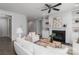 Cozy living room features a modern fireplace and built-in shelves and cabinets at 108 Hillston Ln, Mooresville, NC 28115