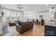 Inviting living room with ample seating, open to kitchen, creating an ideal space for entertaining guests at 108 Hillston Ln, Mooresville, NC 28115