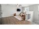 Upstairs living area with hardwood floors and media center at 108 Hillston Ln, Mooresville, NC 28115