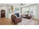 Comfortable living room with built-in shelves surrounding a fireplace, providing a relaxing space at 108 Hillston Ln, Mooresville, NC 28115