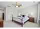 Serene main bedroom with ceiling fan, plenty of natural light, and an ensuite bathroom at 108 Hillston Ln, Mooresville, NC 28115