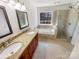 Bathroom featuring double sinks, a soaking tub, and a tiled shower at 12025 Willingdon Rd, Huntersville, NC 28078