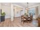 Dining room with a wooden table and chairs, leading to the foyer and other living areas at 1203 Kingsman Nw Ln, Concord, NC 28027