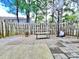 Private fenced-in backyard, with stone tile and a basketball hoop at 12906 Sickles Dr, Charlotte, NC 28273