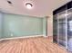 Empty bedroom with wood-look floors, a built in and a neutral green painted wall at 12906 Sickles Dr, Charlotte, NC 28273
