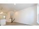 Open-concept living room with hardwood floors, natural light and a staircase at 1311 Cerium Way, Charlotte, NC 28211