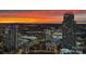 Stunning twilight cityscape view featuring modern high-rise buildings against a vibrant, colorful sky at 210 N Church St # 3606, Charlotte, NC 28202