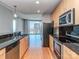 Modern kitchen offering great city views and featuring stainless steel appliances, granite counters, and wood cabinets at 210 N Church St # 3606, Charlotte, NC 28202