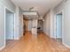 Spacious living room with hardwood floors and an open floor plan to the kitchen, perfect for modern living at 210 N Church St # 3606, Charlotte, NC 28202