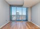 Bright living room with floor-to-ceiling windows offering amazing city views and ample natural light at 210 N Church St # 3606, Charlotte, NC 28202