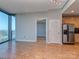 Spacious living room with hardwood floors, offering an open layout with a modern kitchen and city views at 210 N Church St # 3606, Charlotte, NC 28202