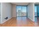 Bright living room with hardwood floors and large windows offering panoramic city views at 210 N Church St # 3606, Charlotte, NC 28202