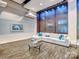 Beautiful condo lobby area with comfortable seating, TV and attractive lighting at 210 N Church St # 3606, Charlotte, NC 28202