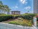 Rooftop garden featuring a pergola and lush plants and flowers providing a beautiful outdoor retreat with city views at 210 N Church St # 3606, Charlotte, NC 28202