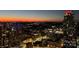Beautiful aerial view of the city at dusk with illuminated buildings and towers at 210 N Church St # 3606, Charlotte, NC 28202