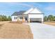 Beautiful white home with a brick-lined porch, two-car garage, and a well-manicured lawn at 2226 Zinker Rd, Rock Hill, SC 29732