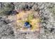 A birds eye view of the property lines of the house with a dark roof and surrounding trees at 2478 Stribling Cir, Lancaster, SC 29720