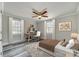 Bedroom featuring hardwood floors, ceiling fan, natural lighting and built-in desk at 2478 Stribling Cir, Lancaster, SC 29720