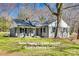 Charming single-story home featuring a classic design, manicured lawn, and inviting front porch at 2478 Stribling Cir, Lancaster, SC 29720