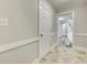 Hallway that provides access to the kitchen and other areas of the home at 2478 Stribling Cir, Lancaster, SC 29720